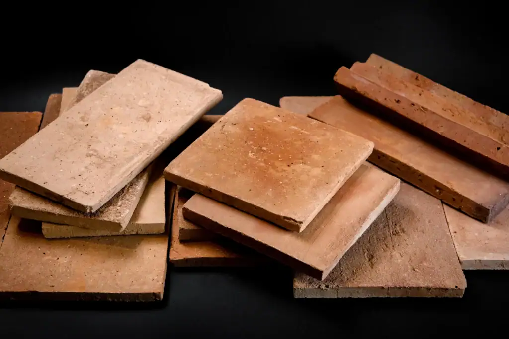 Everything About Terracotta Tiles for Outdoor Spaces Various formats of handcrafted terracotta tiles – group view in natural tones.
